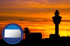 kansas map icon and an airport terminal and control tower at sunset