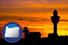 oregon map icon and an airport terminal and control tower at sunset