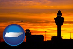 tennessee map icon and an airport terminal and control tower at sunset