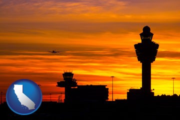 an airport terminal and control tower at sunset - with California icon