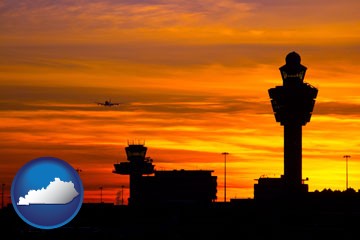 an airport terminal and control tower at sunset - with Kentucky icon