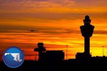 an airport terminal and control tower at sunset - with Maryland icon
