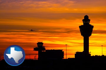 an airport terminal and control tower at sunset - with Texas icon